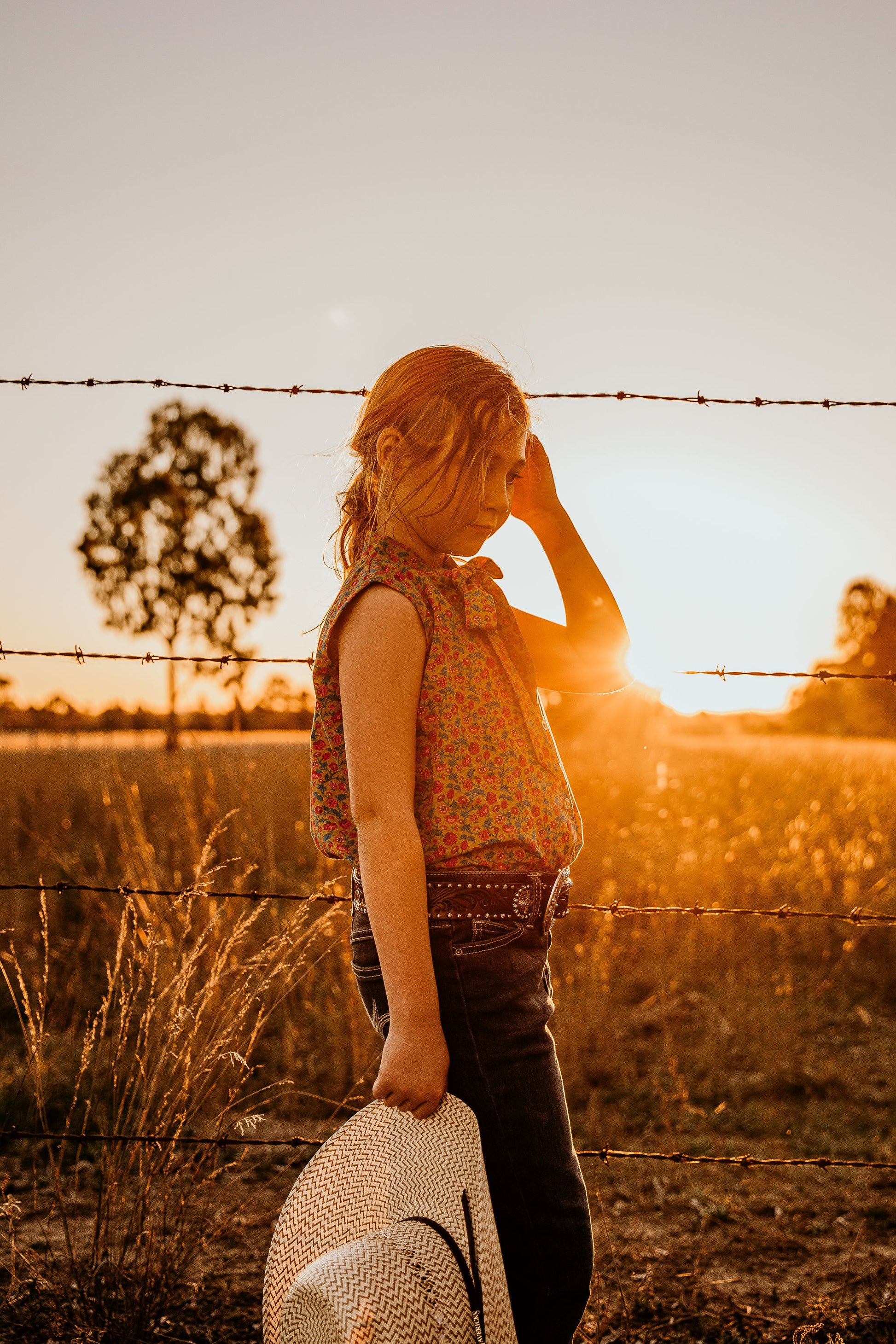 little cowgirl wearing mavericks western straw kids hat unchained eight sleeveless lacey shirt country and western shirt for baby and kids girls areana kids crule girl shirt bush kids buy from the bush in ariat kids jeans ariat kids belt