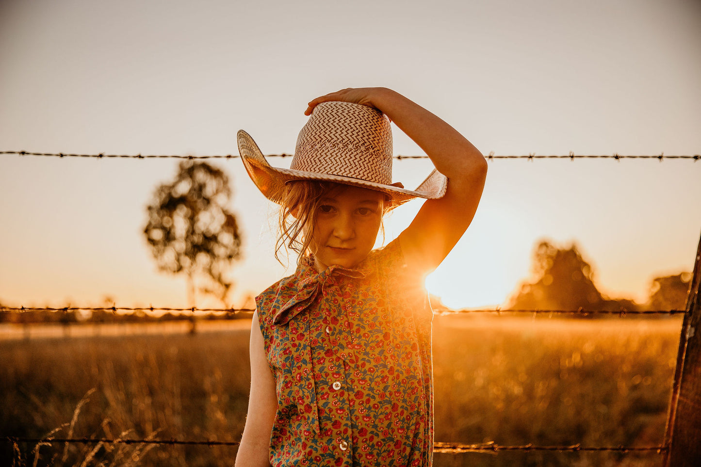 little cowgirl wearing mavericks western straw kids hat unchained eight sleeveless lacey shirt country and western shirt for baby and kids girls areana kids crule girl shirt bush kids buy from the bush