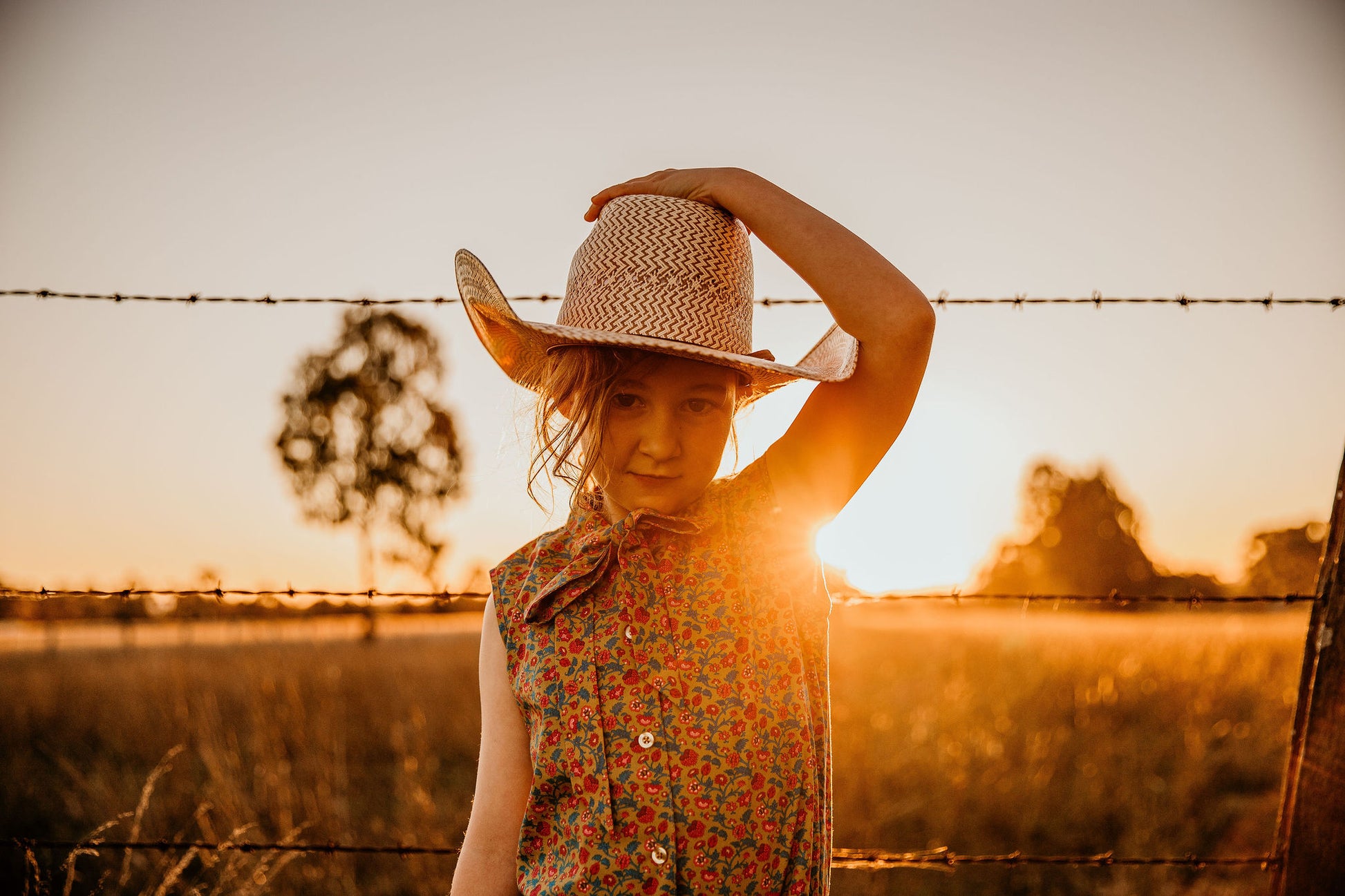 little cowgirl wearing mavericks western straw kids hat unchained eight sleeveless lacey shirt country and western shirt for baby and kids girls areana kids crule girl shirt bush kids buy from the bush