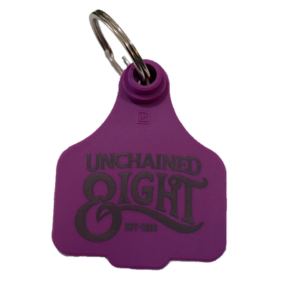 Purple unchained eight cattle tag keyring with classic country and western wear logo