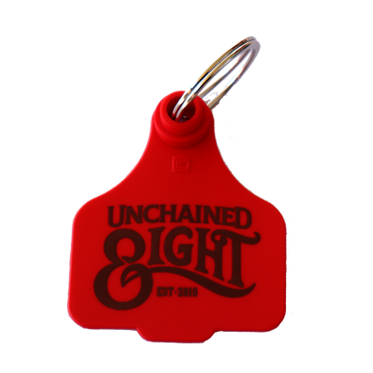 red unchained eight cattle tag keyring with classic country and western wear logo